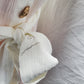 cream long dress with gold buttons and sleeves