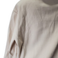 Close-up of a beige coat on a white background