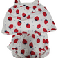 Baby romper with strawberry pattern on a white background