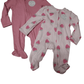 Pink baby footed pajama with strawberry pattern on a white background