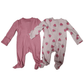Two baby onesies, one pink ribbed and the other with strawberry pattern, on a white background.