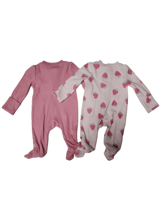 Two baby onesies, one pink ribbed and the other with strawberry pattern, on a white background.