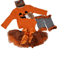 Halloween-themed baby outfit with orange dress, black and white striped leggings, and matching hat on a white background.