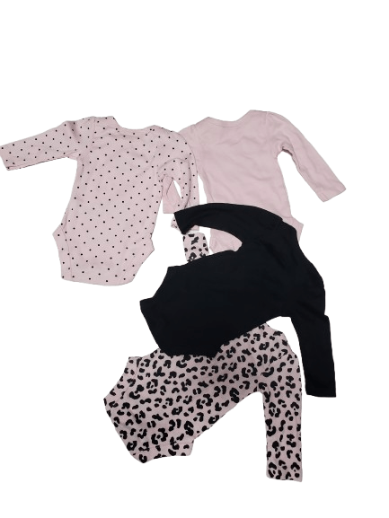 Set of baby clothes including a pink long-sleeve shirt, black pants, and leopard print leggings on a white background.