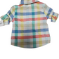 Colorful plaid baby shirt with a matching headband on a white background