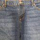Close-up of blue denim jeans with brand label