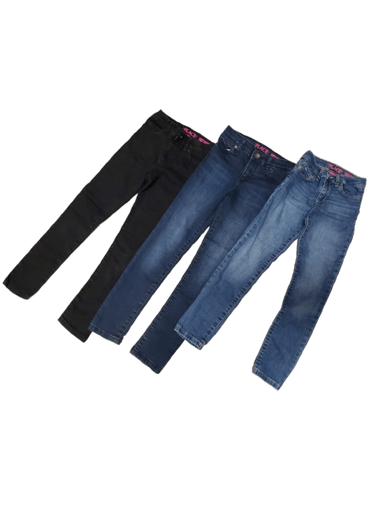Two pairs of jeans, one blue and one black, on a white background.