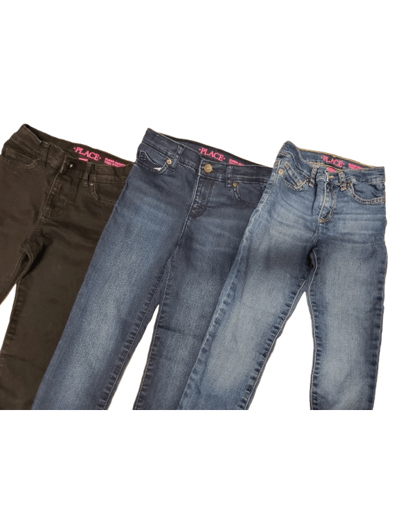 Three pairs of jeans in different colors on a white background