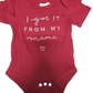 Red baby onesie with text on a white background