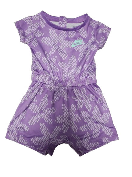 Purple athletic shorts with white geometric pattern on a white background
