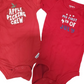 Two red baby onesies with text on a white background