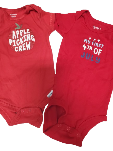 Two red baby onesies with text on a white background