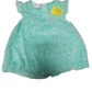 Green baby dress with a yellow flower on a white background