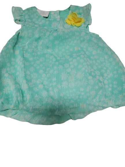 Green dress with a yellow flower on a white background