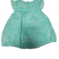 green baby dress with white floral pattern on a white background