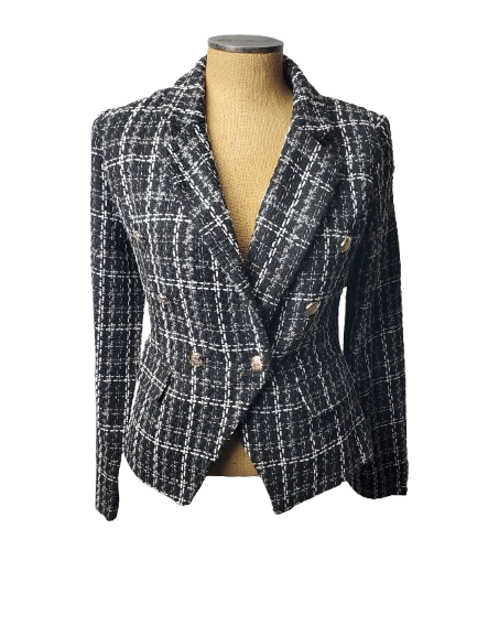 Plaid blazer on a mannequin against a white background