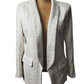 White textured blazer on a mannequin against a white background