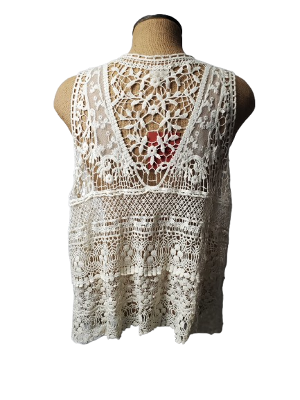 beige lace top on a mannequin with a white background