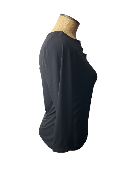 Black long-sleeve top on a mannequin with a white background