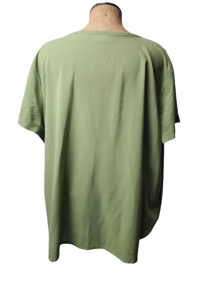 Green blouse on a mannequin with a white background