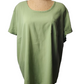 Green blouse on a mannequin against a white background