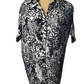 Black and white patterned shirt on a mannequin against a white background