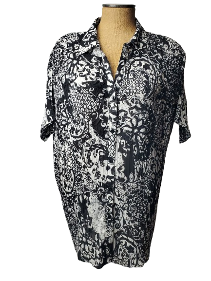 Black and white patterned shirt on a mannequin against a white background