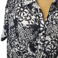 Black and white patterned kimono-style garment on a mannequin.