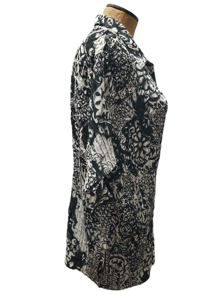 Black and white patterned shirt on a mannequin against a white background