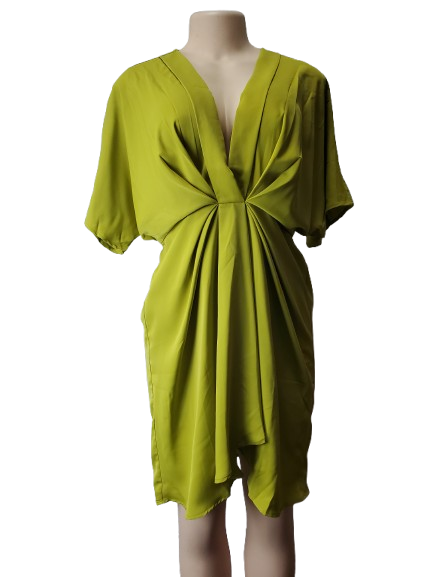 Green dress on a mannequin against a white background