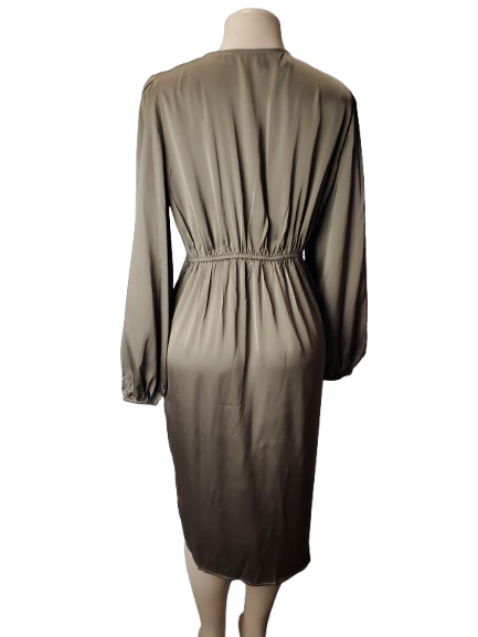 Brown dress on a mannequin against a white background