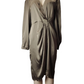Gold satin dress on a mannequin against a white background