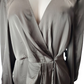 brown long-sleeve top on a mannequin with a plain background
