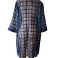 Sheer blue grid patterned dress on a mannequin against a white background