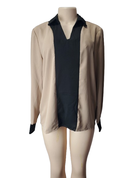 Mannequin wearing a beige blouse with black accents on a white background