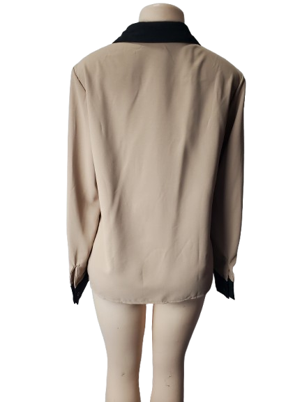 Beige jacket with black trim on a mannequin against a white background