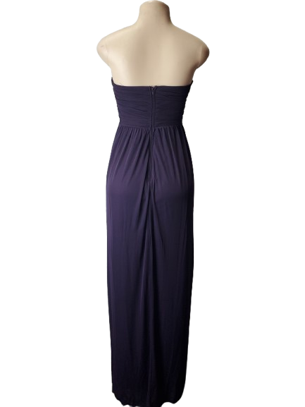 purple strapless gown on a mannequin against a white background