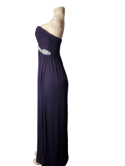 purple one-shoulder dress with a silver embellishment on a white background