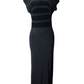 Black evening gown on a mannequin against a white background
