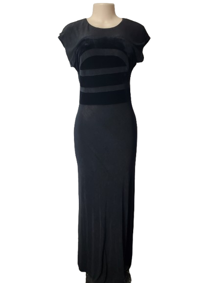 Black evening gown on a mannequin against a white background