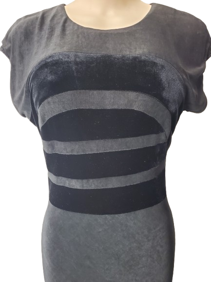 black dress with black horizontal stripes on a mannequin against a white background