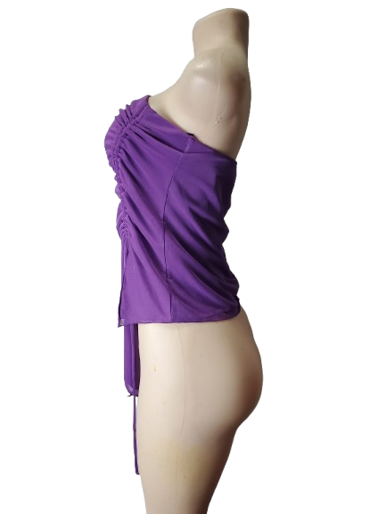 Purple one-shoulder top on a mannequin against a white background