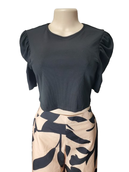 Black top with puff sleeves on a mannequin against a white background