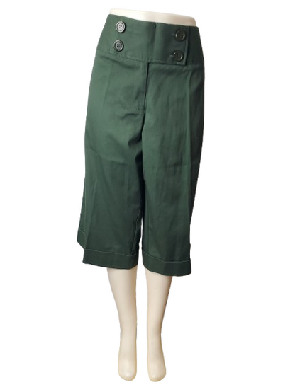 Green capri pants on a mannequin against a white background