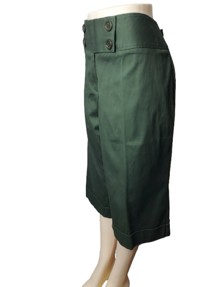Green capris on a mannequin against a white background