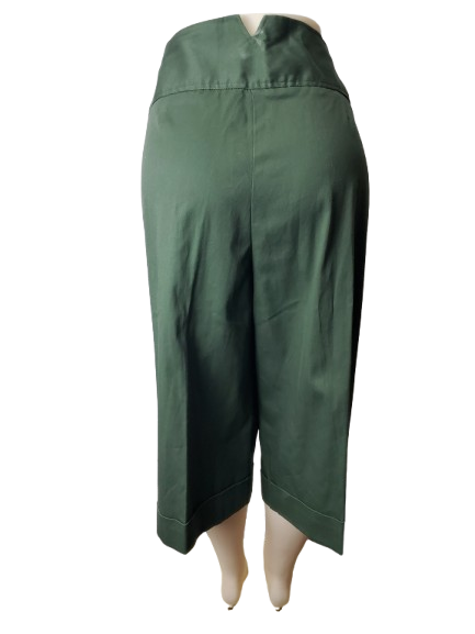Green capris on a mannequin against a white background