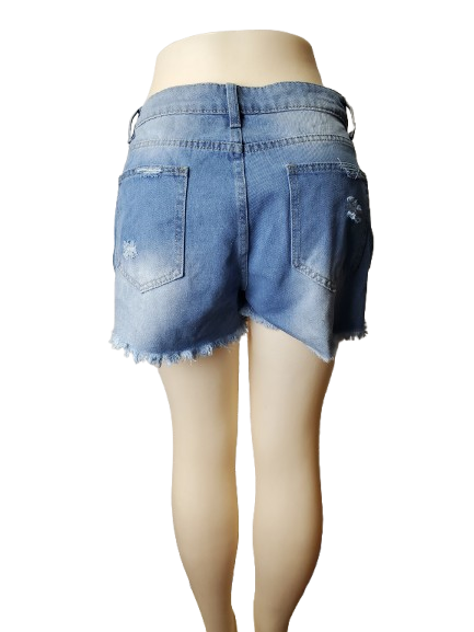 Blue denim shorts on a mannequin against a white background