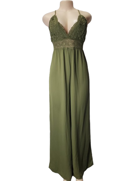 Green jumpsuit on a mannequin against a white background