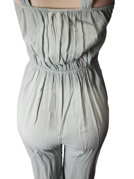 Light green jumpsuit on a white background