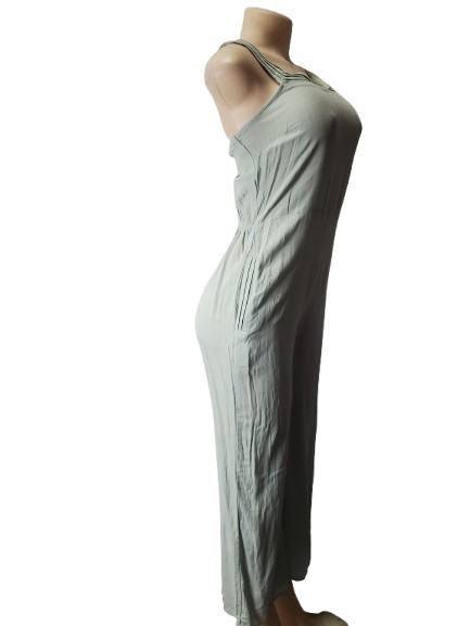 Mannequin wearing a light green jumpsuit on a white background